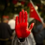 red hand of protester