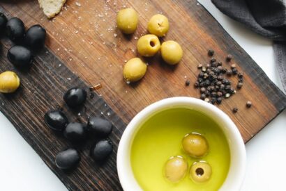 photo of ceramic bowl on top of wooden chopping board