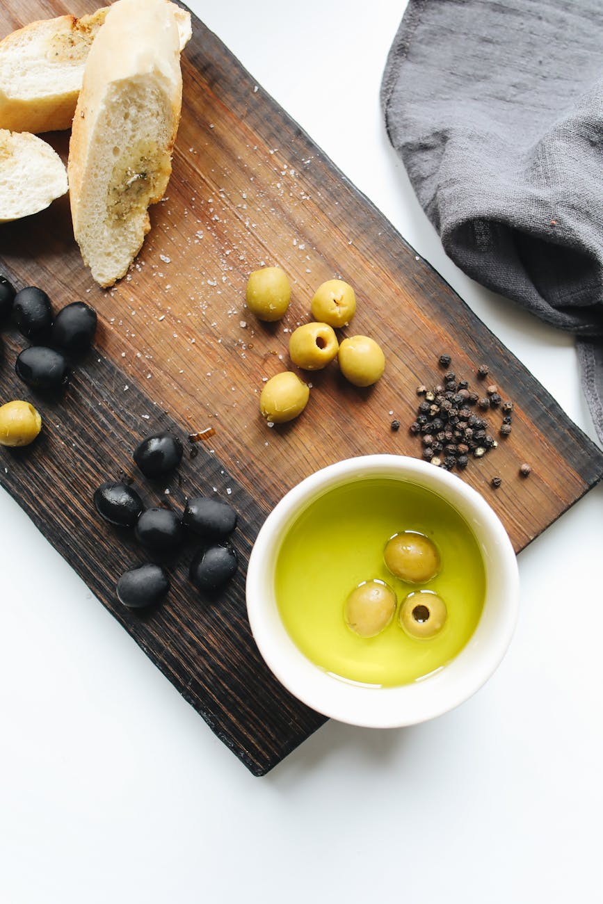 photo of ceramic bowl on top of wooden chopping board