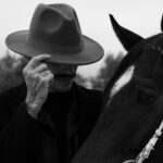 mysterious cowboy and horse in monochrome